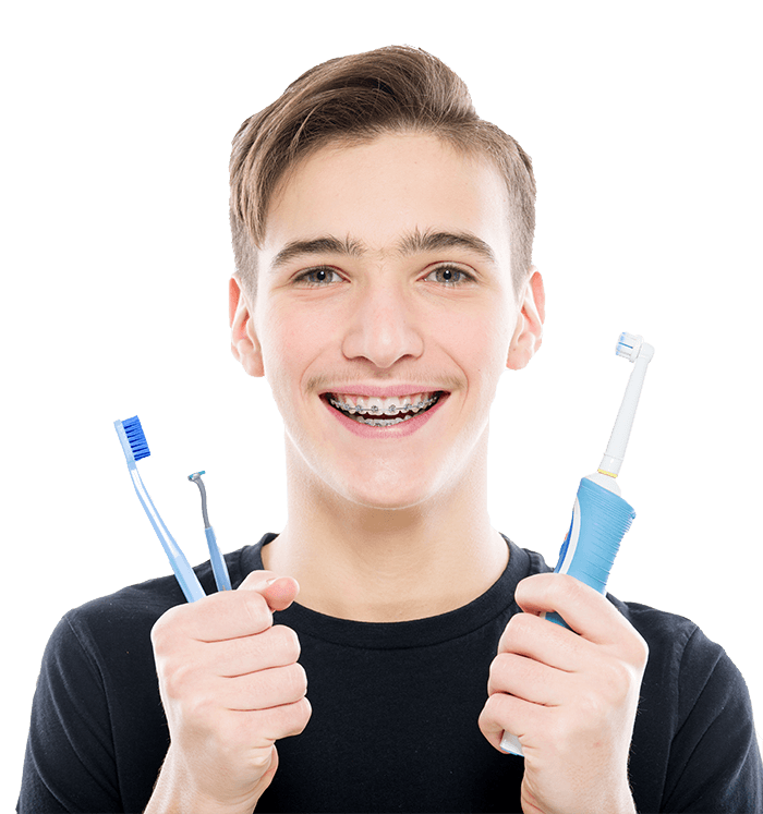 https://www.pavlou-orthodontics.gr/wp-content/uploads/2021/01/teenager-holds-a-toothbrush-and-brush-for-braces.png